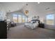 Bright main bedroom featuring vaulted ceilings and expansive windows with scenic outdoor views at 9443 Torrey Way, Arvada, CO 80007