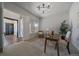 Inviting home office with a comfortable chair, a large window, and a stylish desk at 9443 Torrey Way, Arvada, CO 80007