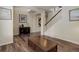 Open foyer with staircase, wood floors, and elegant décor at 24351 E Alamo Dr, Aurora, CO 80016