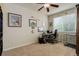A well-lit home office provides a functional workspace and is decorated with animal-themed art at 24351 E Alamo Dr, Aurora, CO 80016