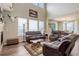 Open concept living room with high ceilings and lots of natural light at 24351 E Alamo Dr, Aurora, CO 80016