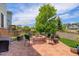 Inviting patio with a fire pit, chairs, and mature landscaping at 24351 E Alamo Dr, Aurora, CO 80016