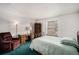 Comfortable bedroom with a desk, chair, and soft lighting, perfect for relaxation at 15350 E Arizona Ave # 106, Aurora, CO 80017