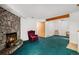 Spacious living room boasting a stone fireplace and classic furnishings at 15350 E Arizona Ave # 106, Aurora, CO 80017
