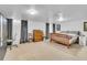 Spacious basement bedroom with ample closet space and a neutral color palette at 1648 S Locust St, Denver, CO 80224