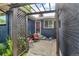 Charming front porch with seating, plants, and a cozy entrance to the home at 1648 S Locust St, Denver, CO 80224
