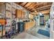 Spacious garage with storage cabinets, pegboard, and work bench space at 1648 S Locust St, Denver, CO 80224
