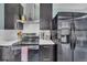 Close-up of the stainless steel oven in the kitchen with stainless refrigerator at 1648 S Locust St, Denver, CO 80224