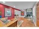 Inviting living room features a gray fireplace, hardwood floors, and charming furniture at 1648 S Locust St, Denver, CO 80224