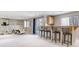 Spacious basement featuring a bar with seating, perfect for entertaining and relaxation at 9109 Ironwood Way, Highlands Ranch, CO 80129