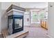 Elegant bathroom featuring a fireplace, soaking tub, shower, and abundant natural light at 9109 Ironwood Way, Highlands Ranch, CO 80129