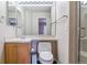 Full bathroom with vanity, mirror, tile shower and toilet at 9109 Ironwood Way, Highlands Ranch, CO 80129