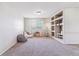Versatile spare room with built-in shelving, perfect for a home office or study at 9109 Ironwood Way, Highlands Ranch, CO 80129