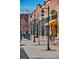 A vibrant commercial street featuring storefronts and street lamps, with retail businesses and a welcoming ambiance at 9109 Ironwood Way, Highlands Ranch, CO 80129
