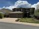 Inviting two-story home with a neatly landscaped front yard, a two car garage, and a beautiful blue sky at 9109 Ironwood Way, Highlands Ranch, CO 80129