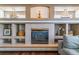Close up of the fireplace with custom shelving at 9109 Ironwood Way, Highlands Ranch, CO 80129