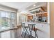Bright kitchen features a breakfast bar with seating and stainless steel appliances at 9109 Ironwood Way, Highlands Ranch, CO 80129