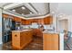 Spacious kitchen with an island, stainless steel appliances, and custom cabinetry, perfect for cooking at 9109 Ironwood Way, Highlands Ranch, CO 80129