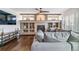 Spacious living room showcasing a fireplace and built-in shelving at 9109 Ironwood Way, Highlands Ranch, CO 80129