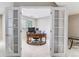 Home office featuring french doors, a large wooden desk, and a window for natural light at 9109 Ironwood Way, Highlands Ranch, CO 80129