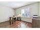 Bright office space with a wooden desk and large window at 9109 Ironwood Way, Highlands Ranch, CO 80129