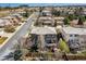 Aerial view of a well maintained, two-story home featuring a deck, nice yard and a community neighborhood at 9109 Ironwood Way, Highlands Ranch, CO 80129