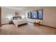 Serene bedroom featuring large windows, plush carpeting, and neutral decor for a relaxing retreat at 900 Poplar Ave, Boulder, CO 80304