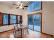 Dining room with vaulted ceiling, hardwood floors, unique windows, and sliding door access to the deck at 900 Poplar Ave, Boulder, CO 80304