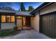 Inviting front entrance showcasing a covered bench and direct access to the attached garage at 900 Poplar Ave, Boulder, CO 80304