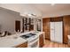 Kitchen featuring wooden cabinets, white countertops and white refrigerator at 900 Poplar Ave, Boulder, CO 80304