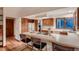 Kitchen features wooden cabinets, white countertops, and bar seating at 900 Poplar Ave, Boulder, CO 80304