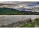 Scenic lake view of the surrounding mountains under a cloudy sky, offering a serene landscape at 900 Poplar Ave, Boulder, CO 80304