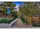 Charming neighborhood scene with a walking path, street sign, and trees, providing a peaceful setting at 900 Poplar Ave, Boulder, CO 80304