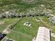 Aerial view featuring a gazebo, with a house and shop, amidst fields under a bright blue sky at 68251 E 96Th Ave, Byers, CO 80103