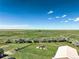 This aerial shot features a gazebo and large field, with a house and shop on the property at 68251 E 96Th Ave, Byers, CO 80103