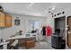 Basement room with a crafting and workspace setup, including lighting and a large window at 68251 E 96Th Ave, Byers, CO 80103