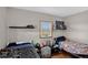 Shared bedroom with twin beds and a window, complete with personal decor at 68251 E 96Th Ave, Byers, CO 80103