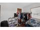 Bedroom space includes a closet, open clothing rack, and furnishings at 68251 E 96Th Ave, Byers, CO 80103