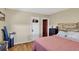 Bedroom showcasing hardwood floors and a rustic wooden headboard, offering a cozy and inviting space at 68251 E 96Th Ave, Byers, CO 80103