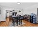 Inviting dining area featuring a stylish table with seating and classic hardwood flooring at 68251 E 96Th Ave, Byers, CO 80103