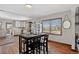 Cozy dining area featuring a stylish table with seating and lovely hardwood flooring at 68251 E 96Th Ave, Byers, CO 80103