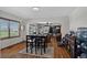 Dining area with table, chairs, hardwood floors, and neutral decor at 68251 E 96Th Ave, Byers, CO 80103