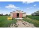 This is an exterior view of the metal barn doors on a sunny day at 68251 E 96Th Ave, Byers, CO 80103