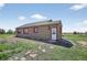 Charming one-story home featuring a yard, neutral paint, white trim, and a shingled roof at 68251 E 96Th Ave, Byers, CO 80103
