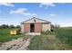 This is an exterior view of the metal barn doors partially opened at 68251 E 96Th Ave, Byers, CO 80103