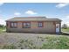 This exterior view shows the side of the house, featuring a shingled roof and yard at 68251 E 96Th Ave, Byers, CO 80103