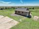 Charming single-story home with neutral siding, a white front door and green lawn at 68251 E 96Th Ave, Byers, CO 80103
