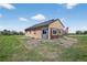 This exterior shows a home with a metal addition and an American flag in the yard at 68251 E 96Th Ave, Byers, CO 80103