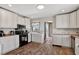 Spacious kitchen featuring white cabinetry, laminate countertops, and a range oven at 68251 E 96Th Ave, Byers, CO 80103