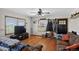 Cozy living room featuring hardwood floors, natural light, and comfortable seating at 68251 E 96Th Ave, Byers, CO 80103